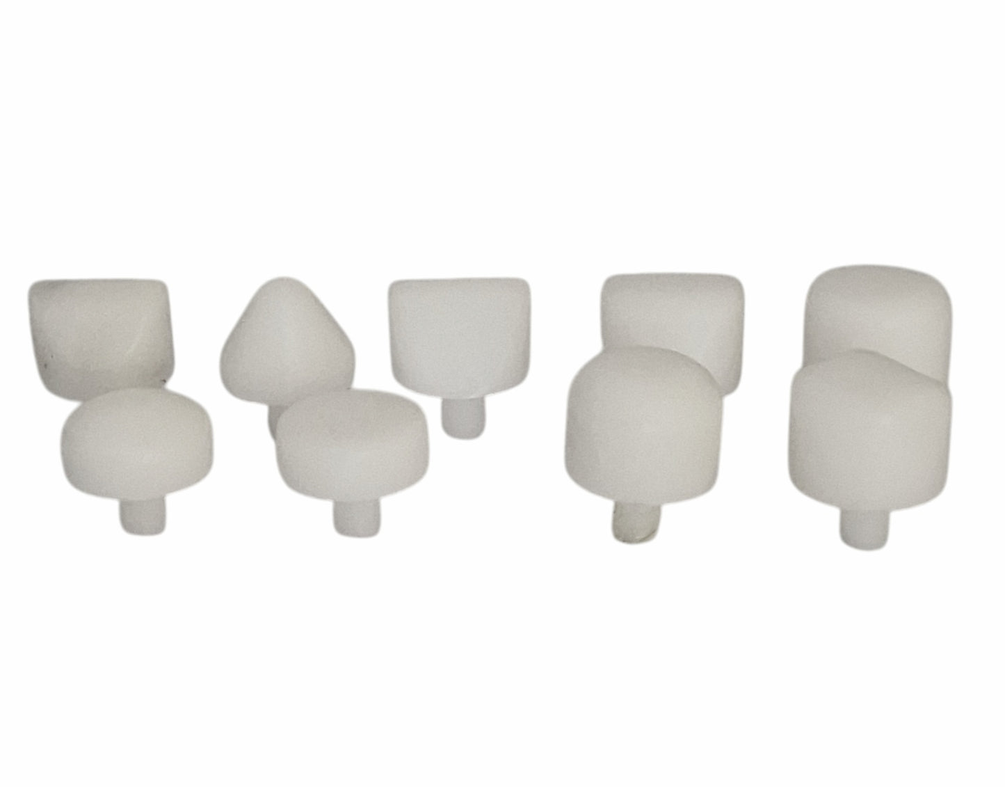 Set of nine white Delrin replacement hammer heads in various shapes, used for non-marring metal forming and jewellery making.