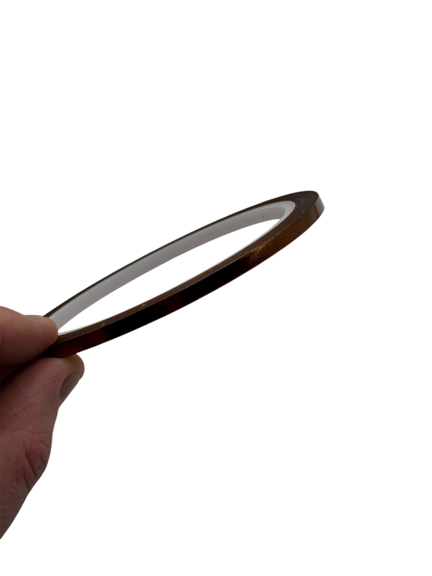 Hand holding a roll of polymide tape