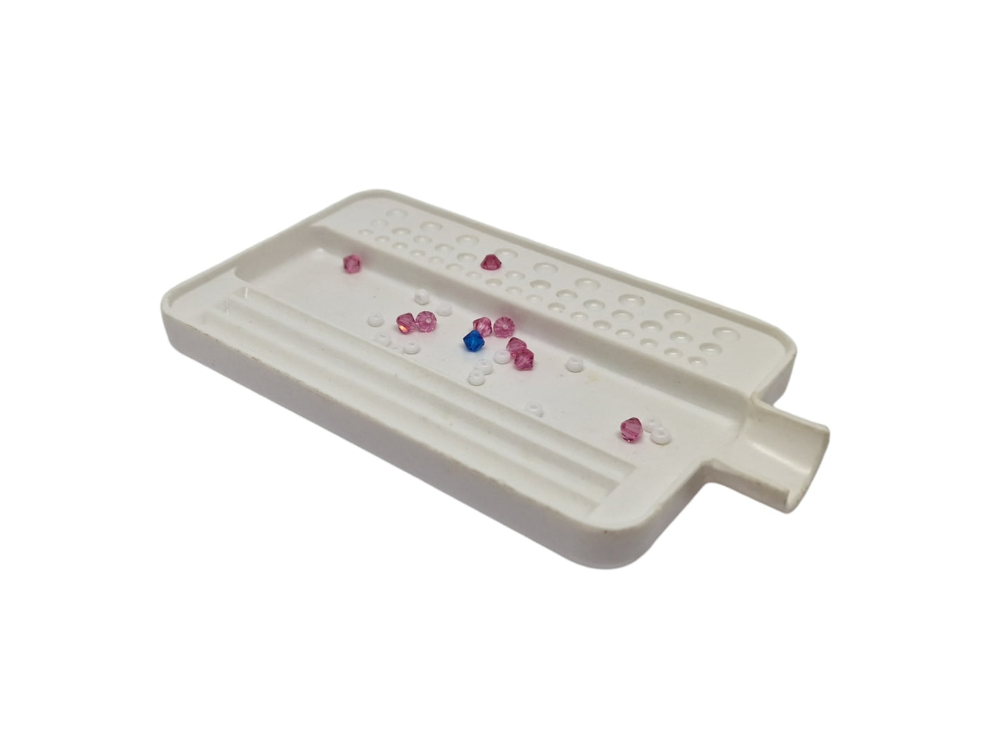 White stone tray with beads inside