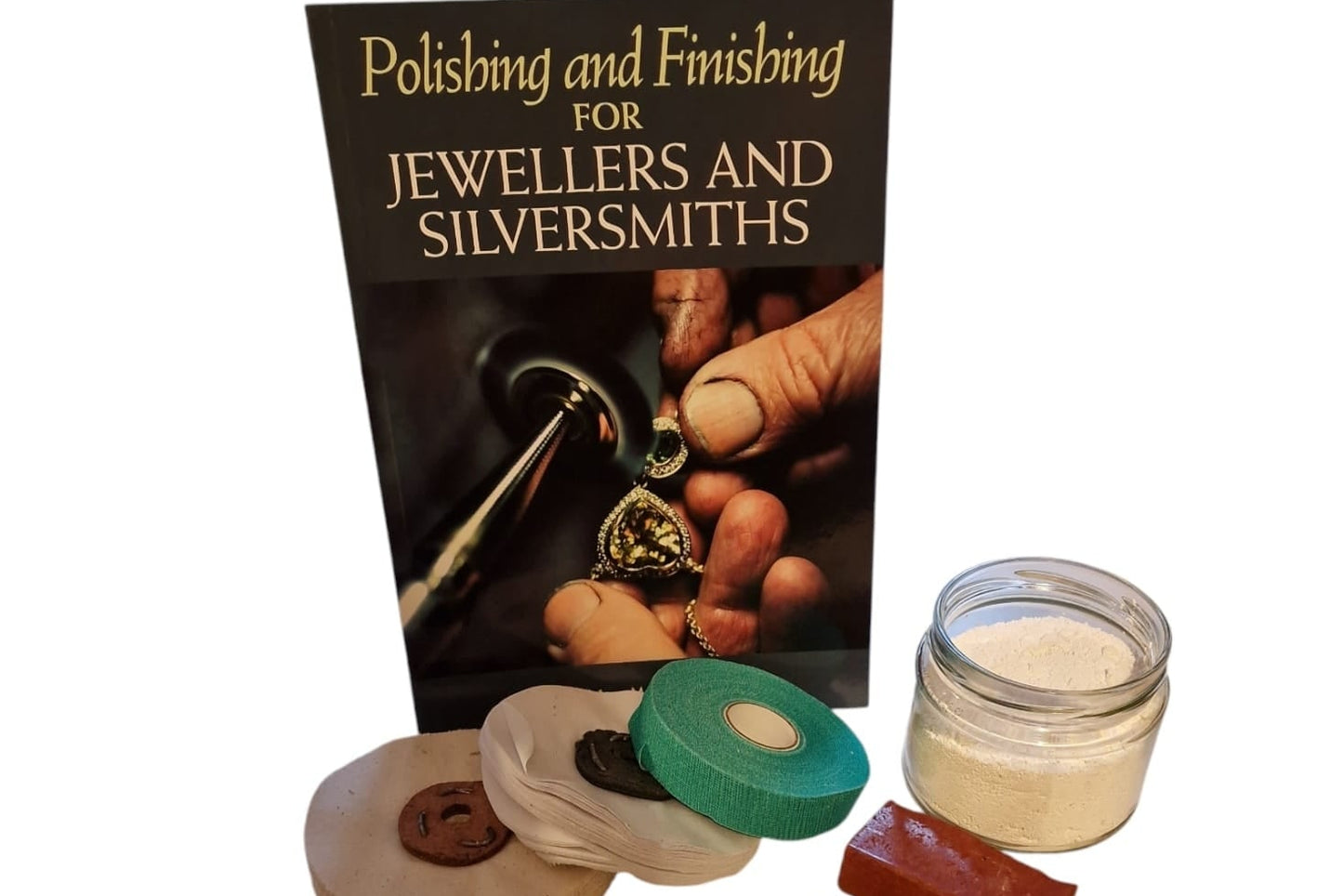 A collection of polishing and finishing tools for jewellers and silversmiths, including a book, finger tape, a calico mop, a reflex mop, various powder compounds, and emery buffing sticks.