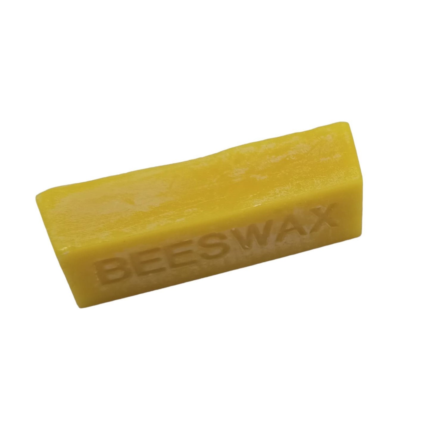A 25 gram block of yellow beeswax with the word 'BEESWAX' stamped on it.