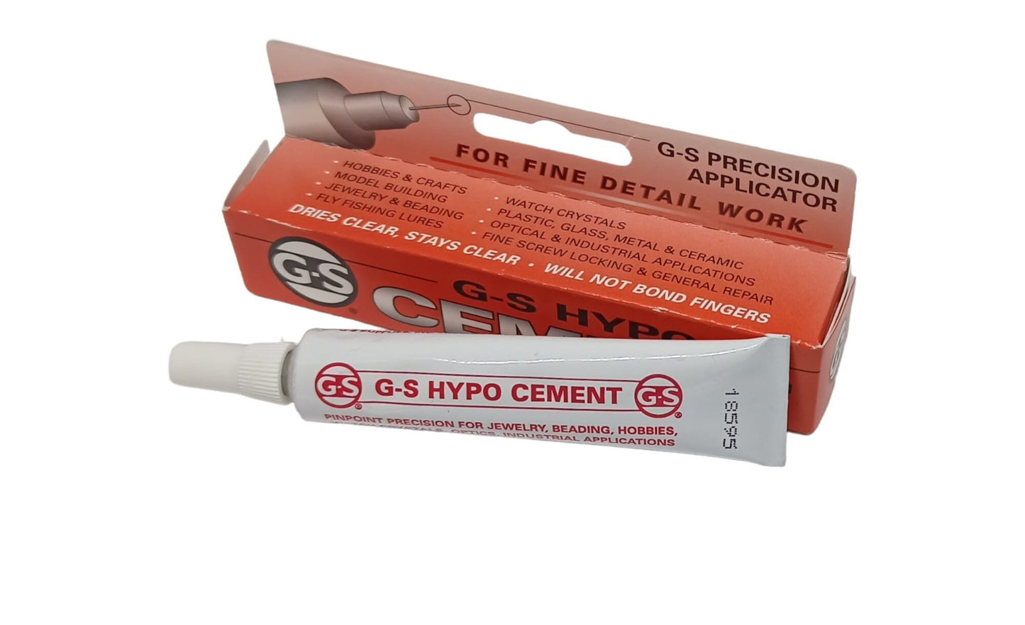 Hypo cement glue tube sitting in front of the packaging box