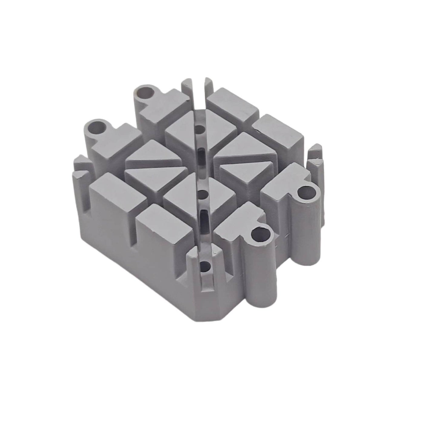 A gray plastic watch bracelet holding block with multiple grooves.