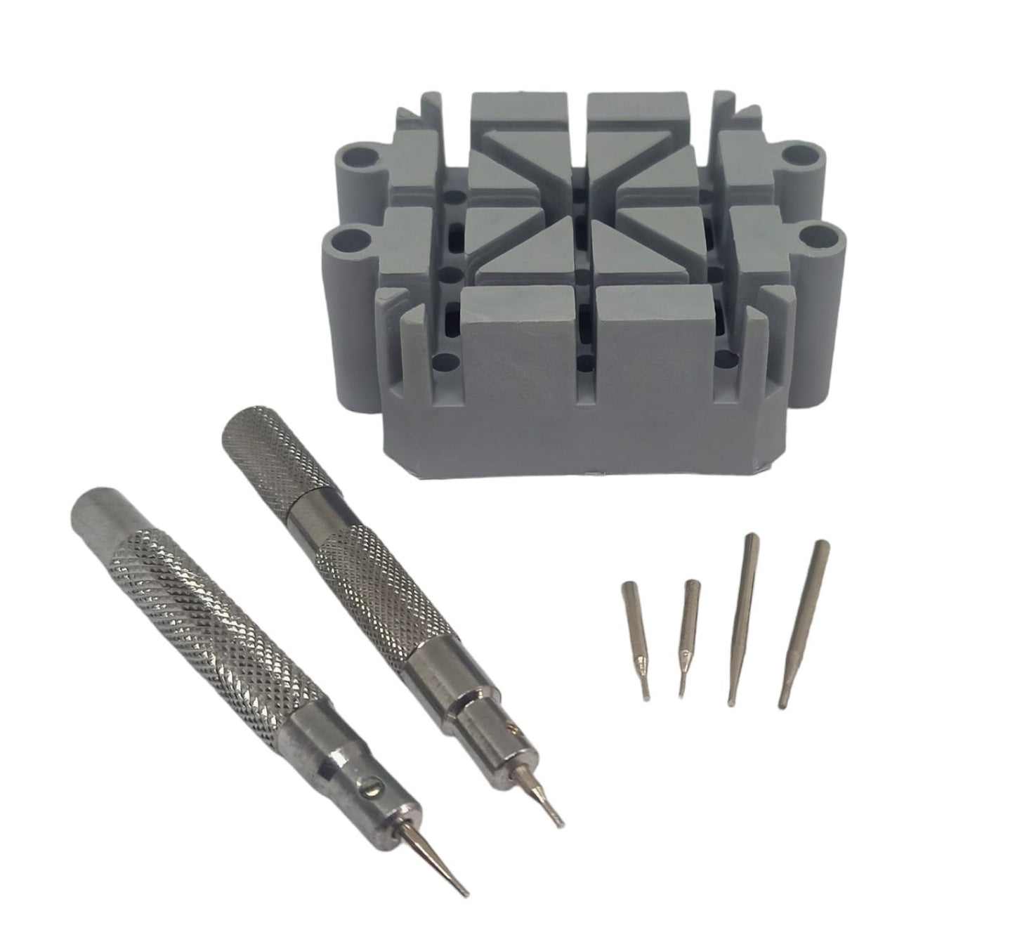 A set including a gray plastic bracelet pin removal tool holder and two metal punches with three metal pins.