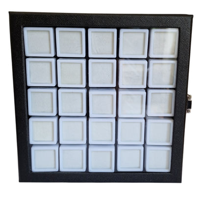 Black display case with white compartments on a white background