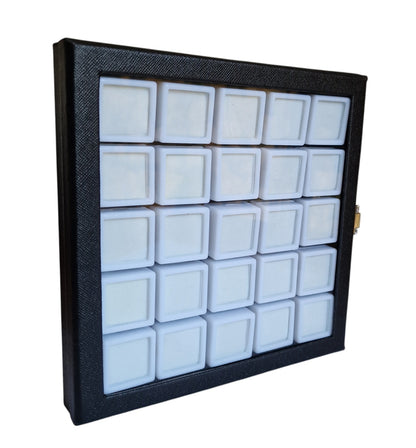 Black display case with multiple compartments for jewelry on a white background