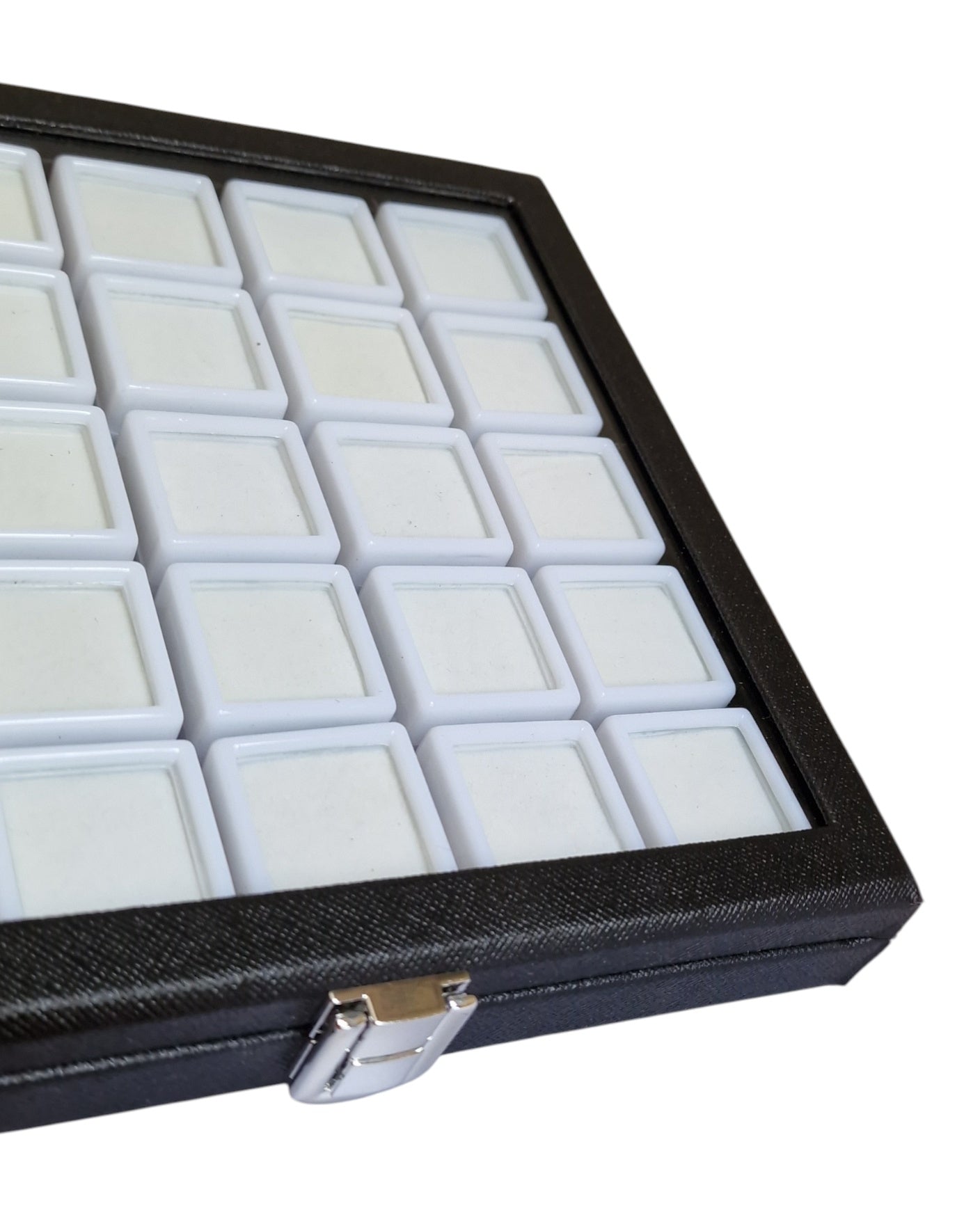 Black jewelry display case with multiple compartments on a white background