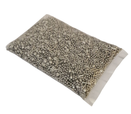 A sealed plastic bag filled with mixed stainless steel shot in various shapes including balls, pins, and satellite pieces, used for jewellery polishing in barrelling or tumbling machines.”