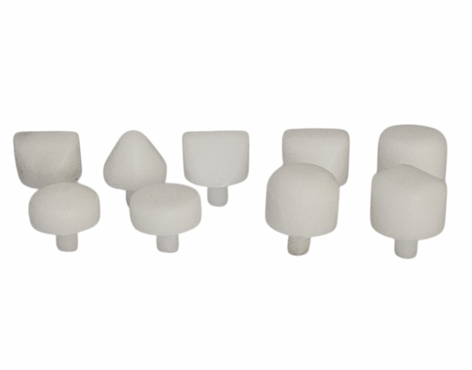 Set of nine white Delrin replacement hammer heads in various shapes, used for non-marring metal forming and jewellery making.