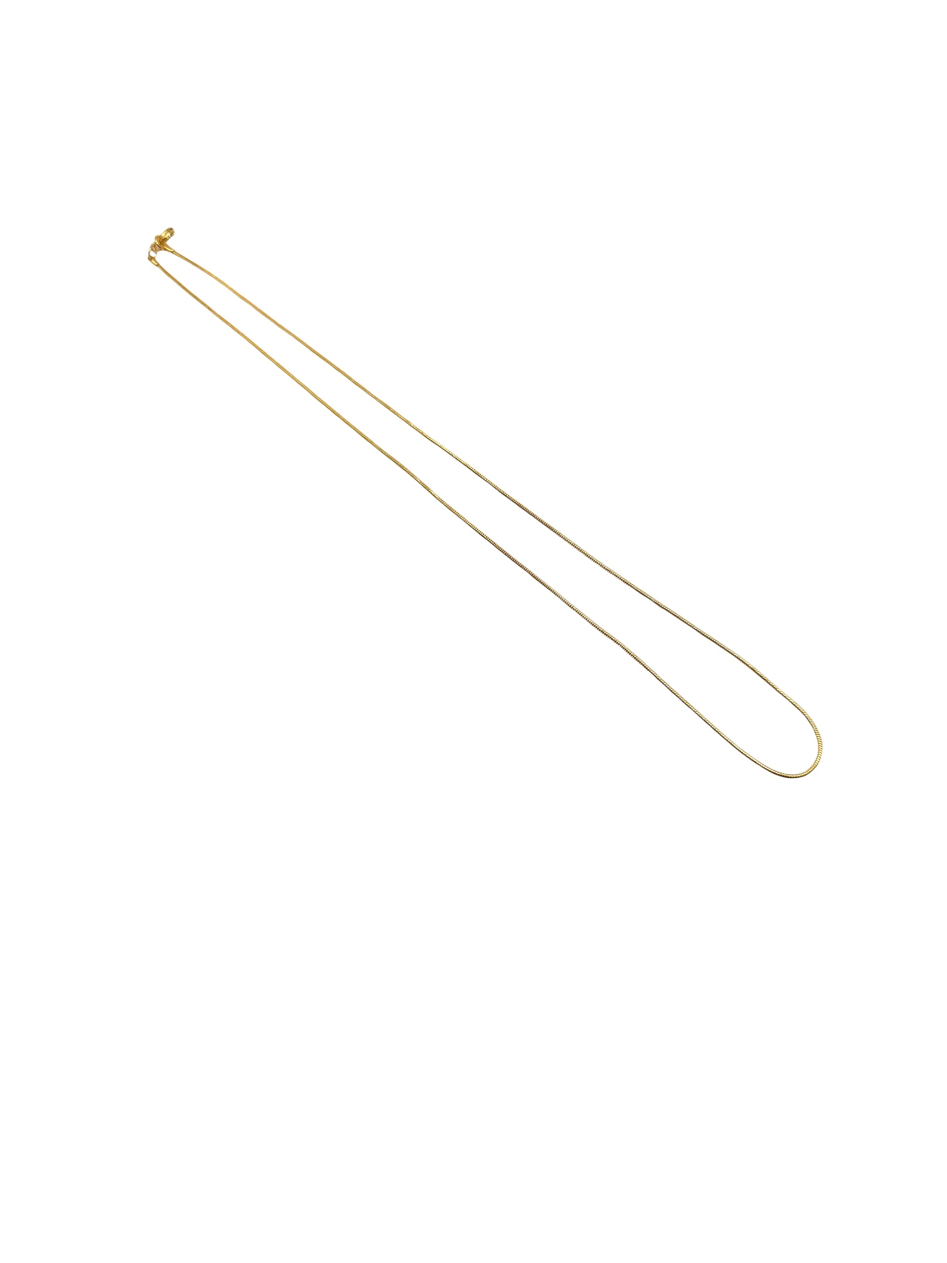 Gold necklace on a white background