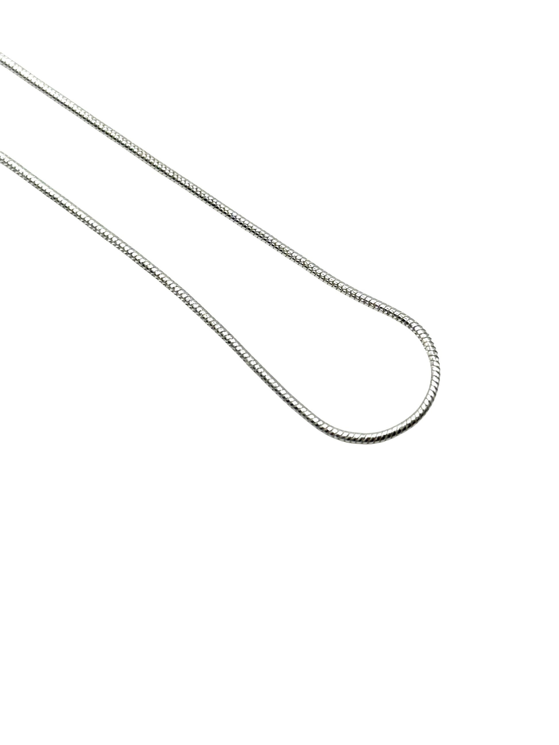 Silver chain necklace on a white background