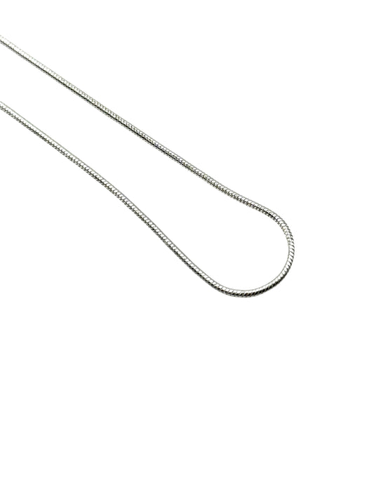 Silver chain necklace on a white background