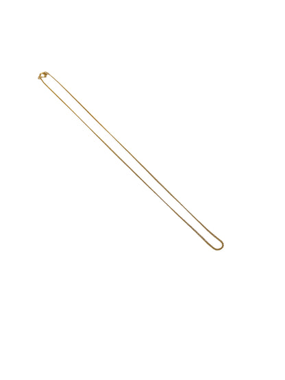 Gold necklace chain on a white background