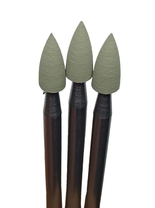 Three conical shaped rubber polishers with a light green color on a white background.