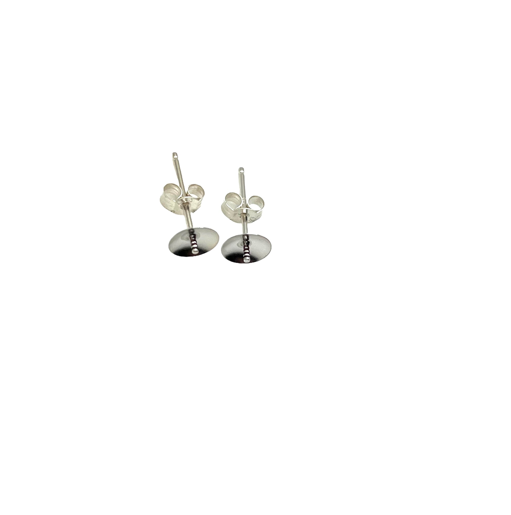 A pair of sterling silver stud earrings with posts and cups, isolated on a white background