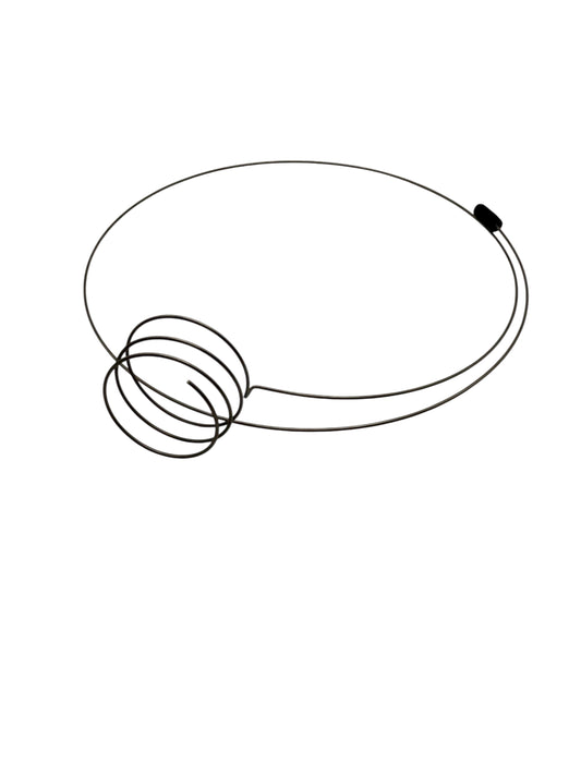 Steel wire eyeglass holder on white background
