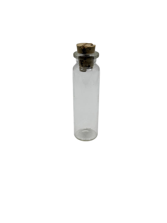 Clear glass bottle with a cork cap on a white background