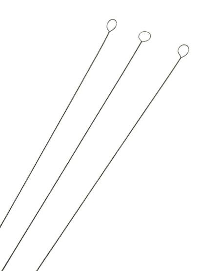 Beading needles on white background close up