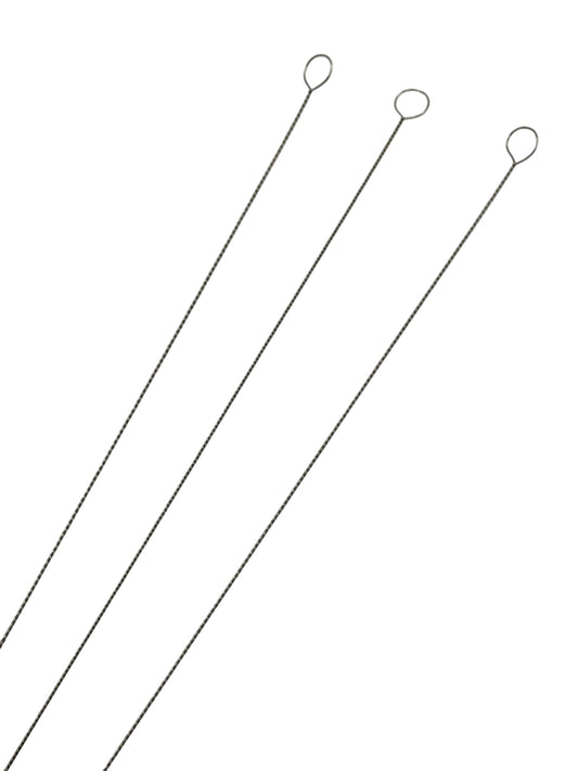 Beading needles on white background close up