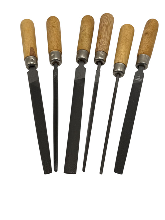 Set of six files with wooden handles on a white background