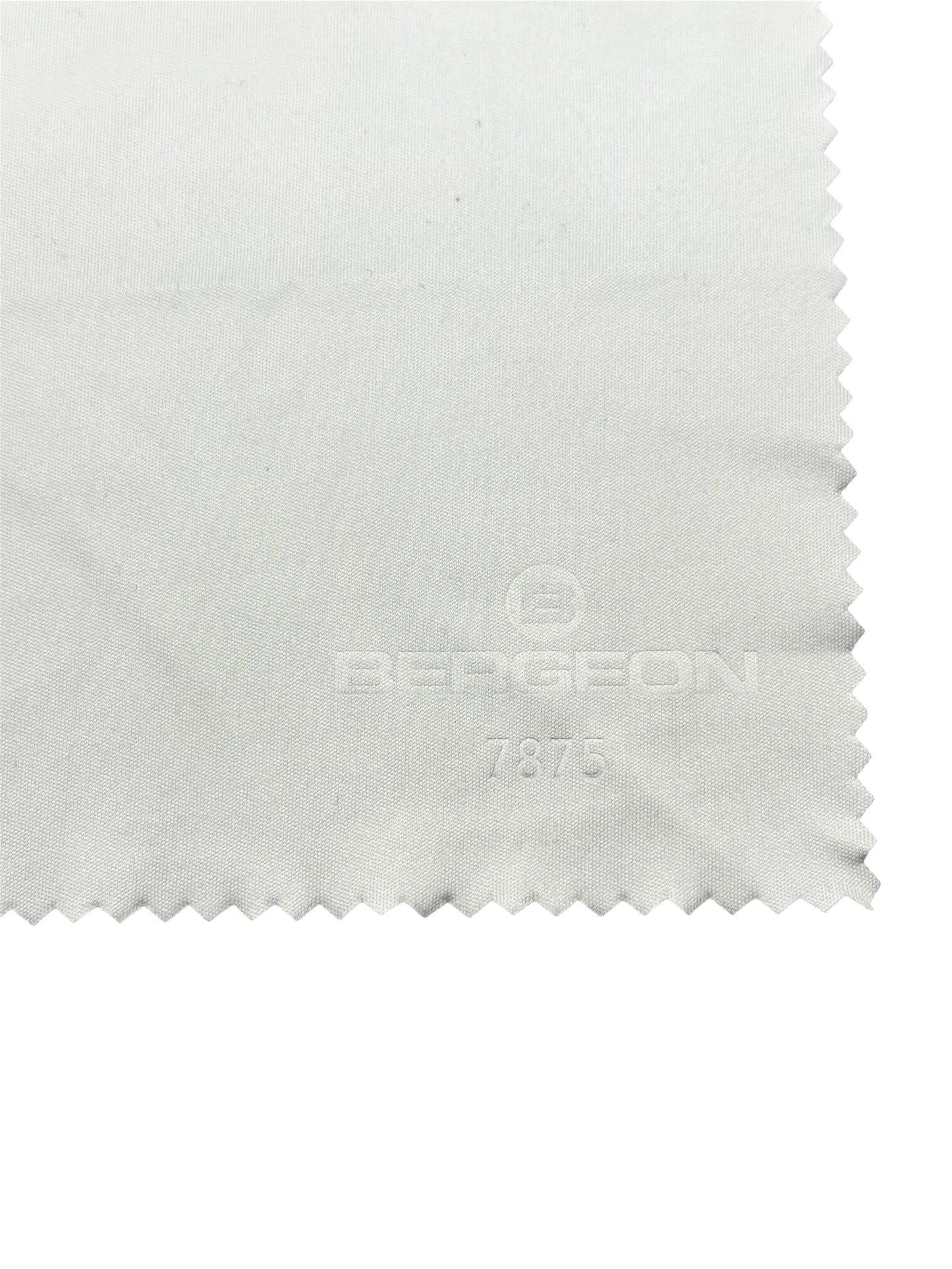 Close-up of a white fabric with a brand logo on a white background