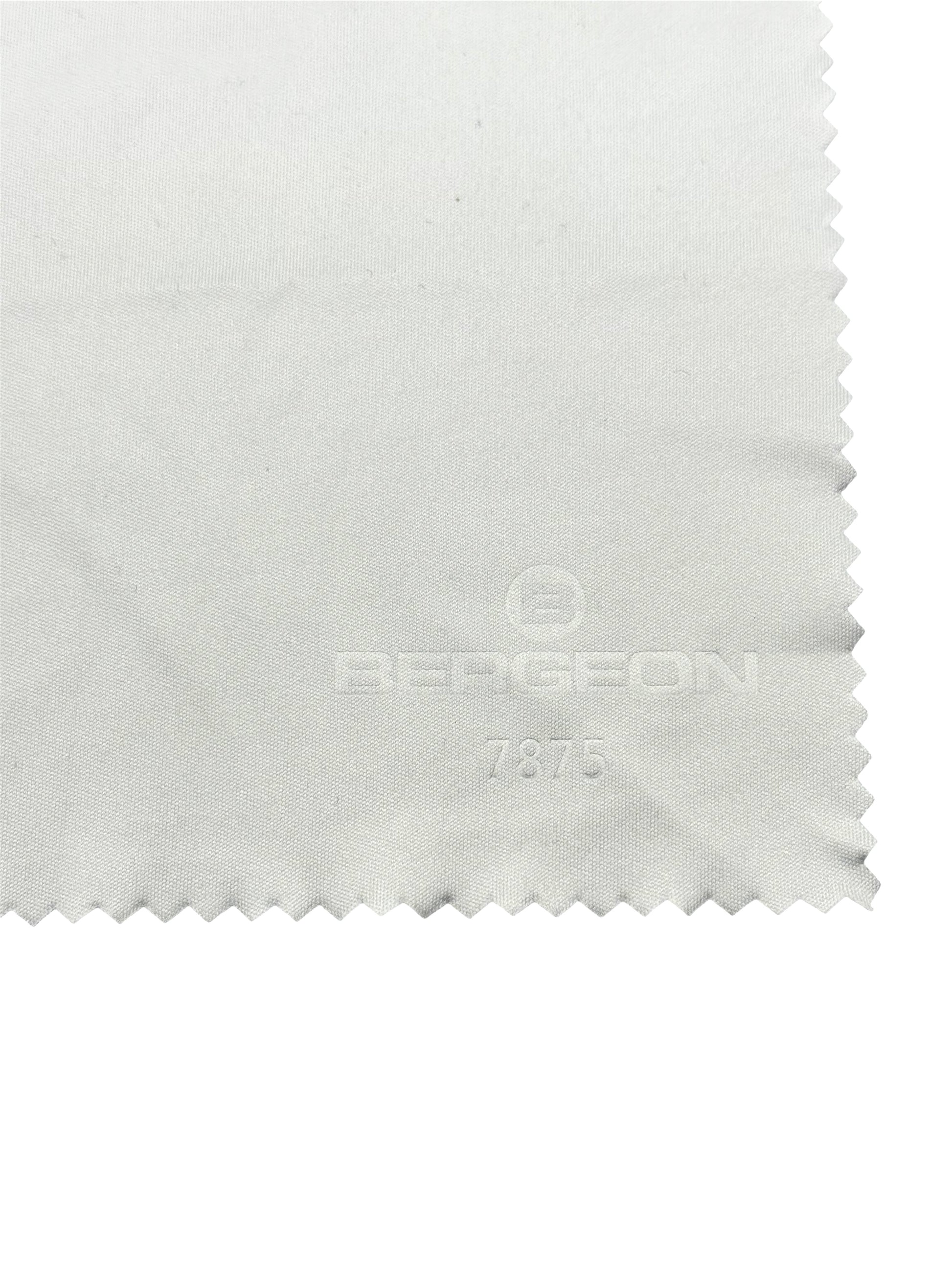Close-up of a white fabric with a brand logo on a white background