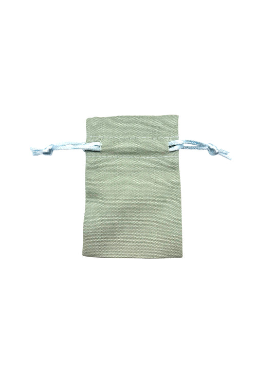 Green drawstring pouch on a white background