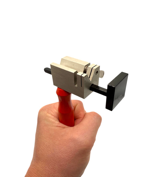 Precision tube cutter with red handle for jewelry making, ideal for cutting soft metal tubing in detailed designs.