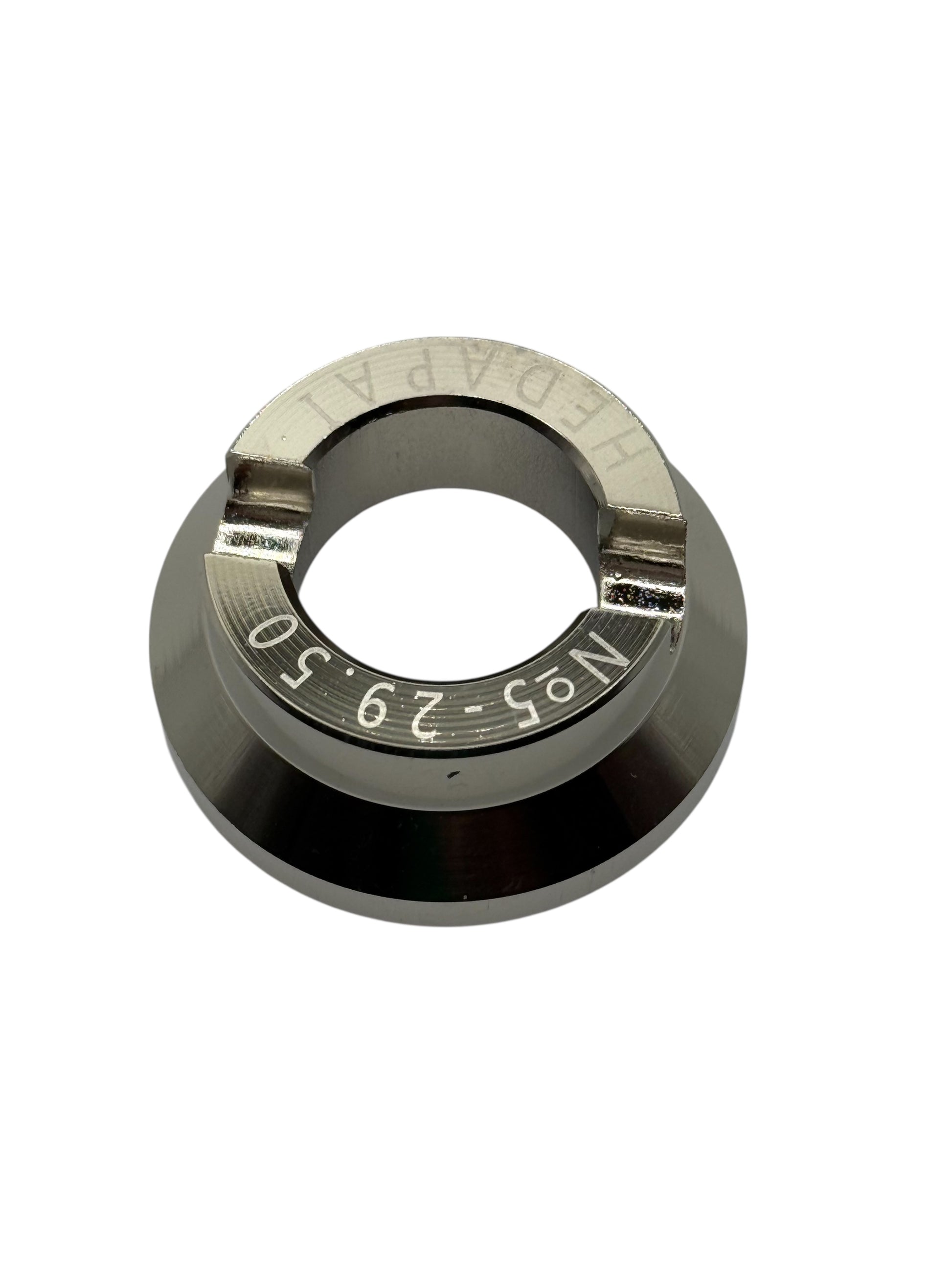 Metal die aperture ring with number markings on a white background