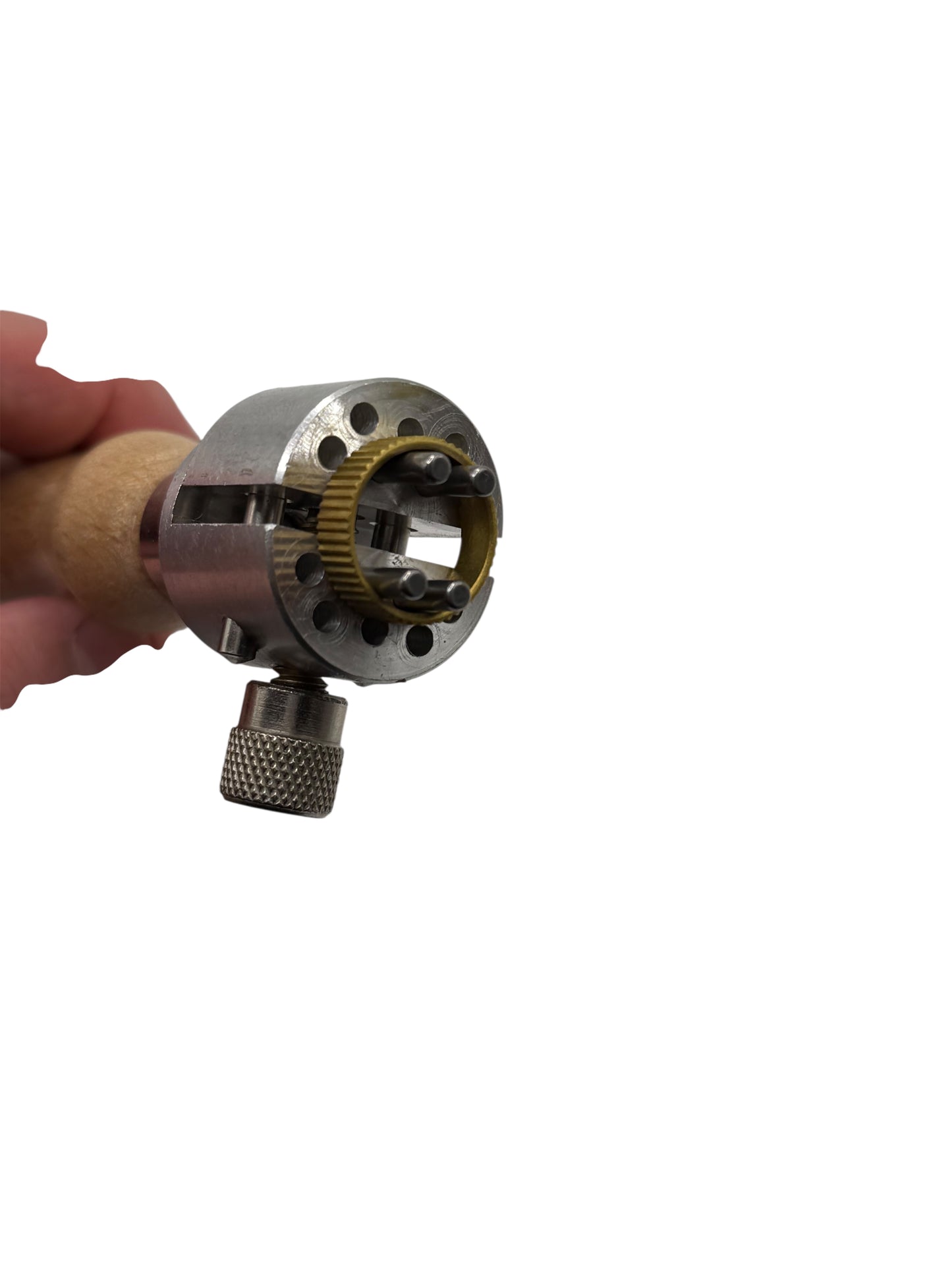 Metal tool with wooden handle held by a hand on a white background