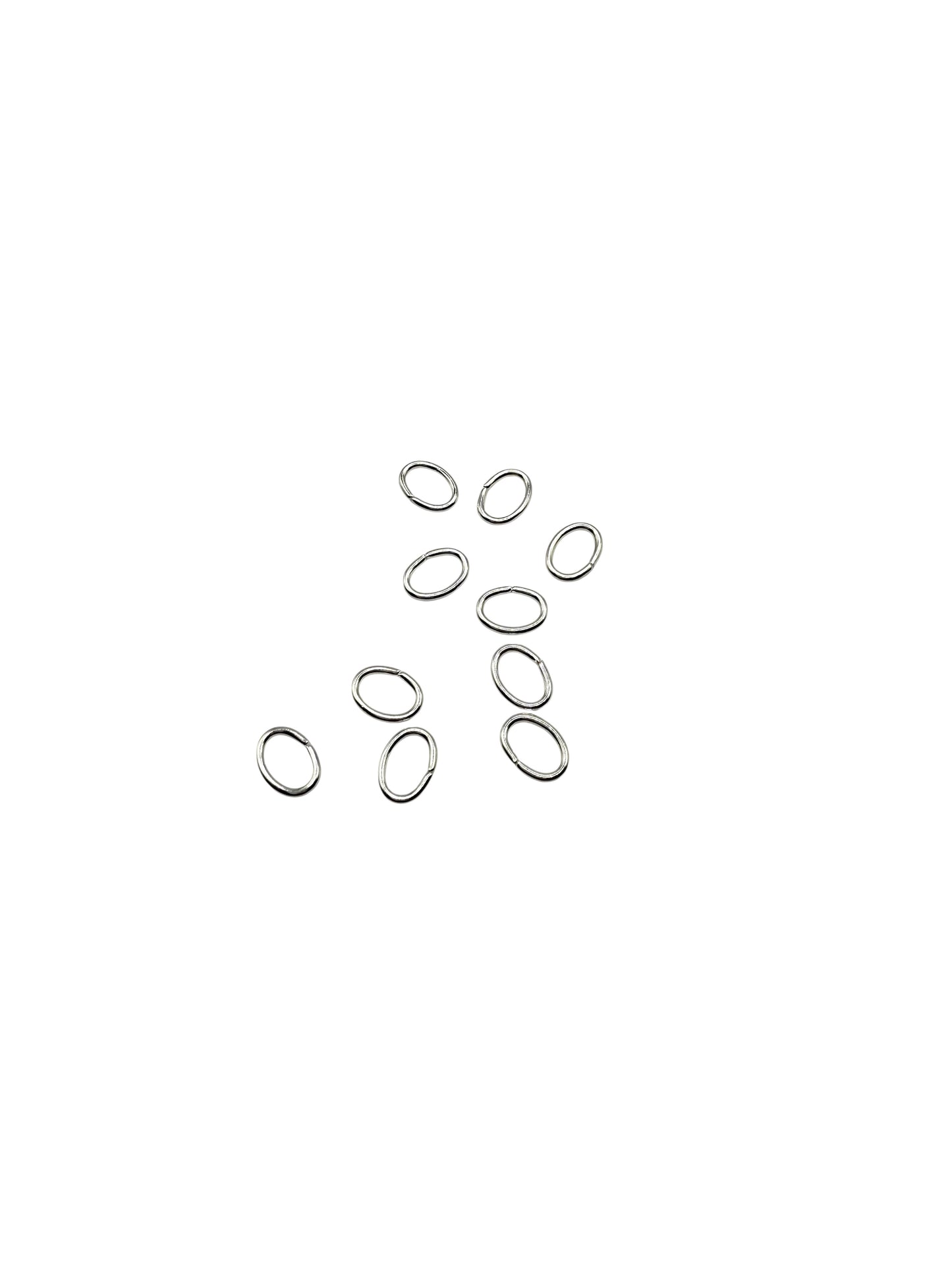 Silver oval jump rings on a white background