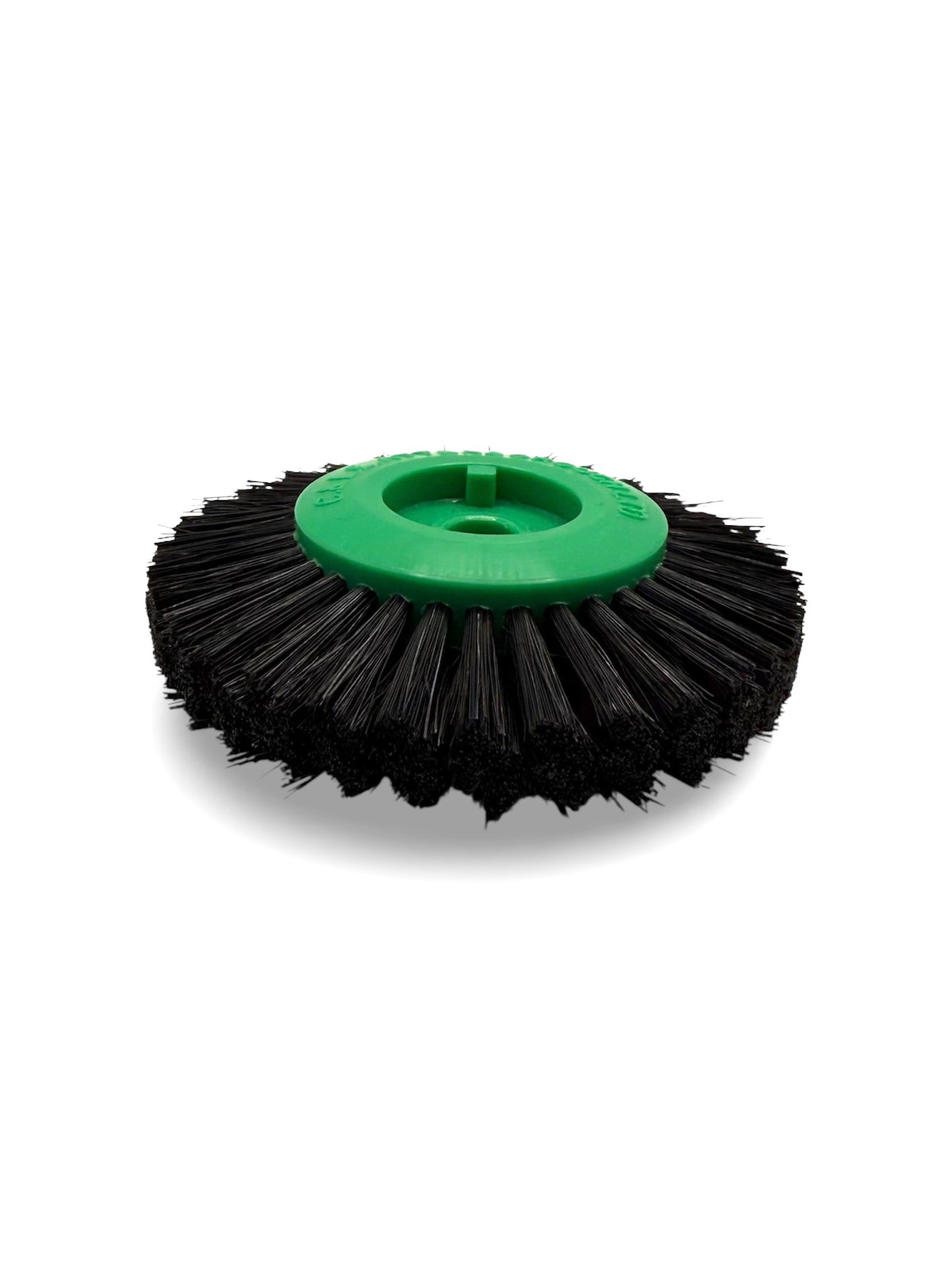 Circular black bristle brush with a green plastic centre
