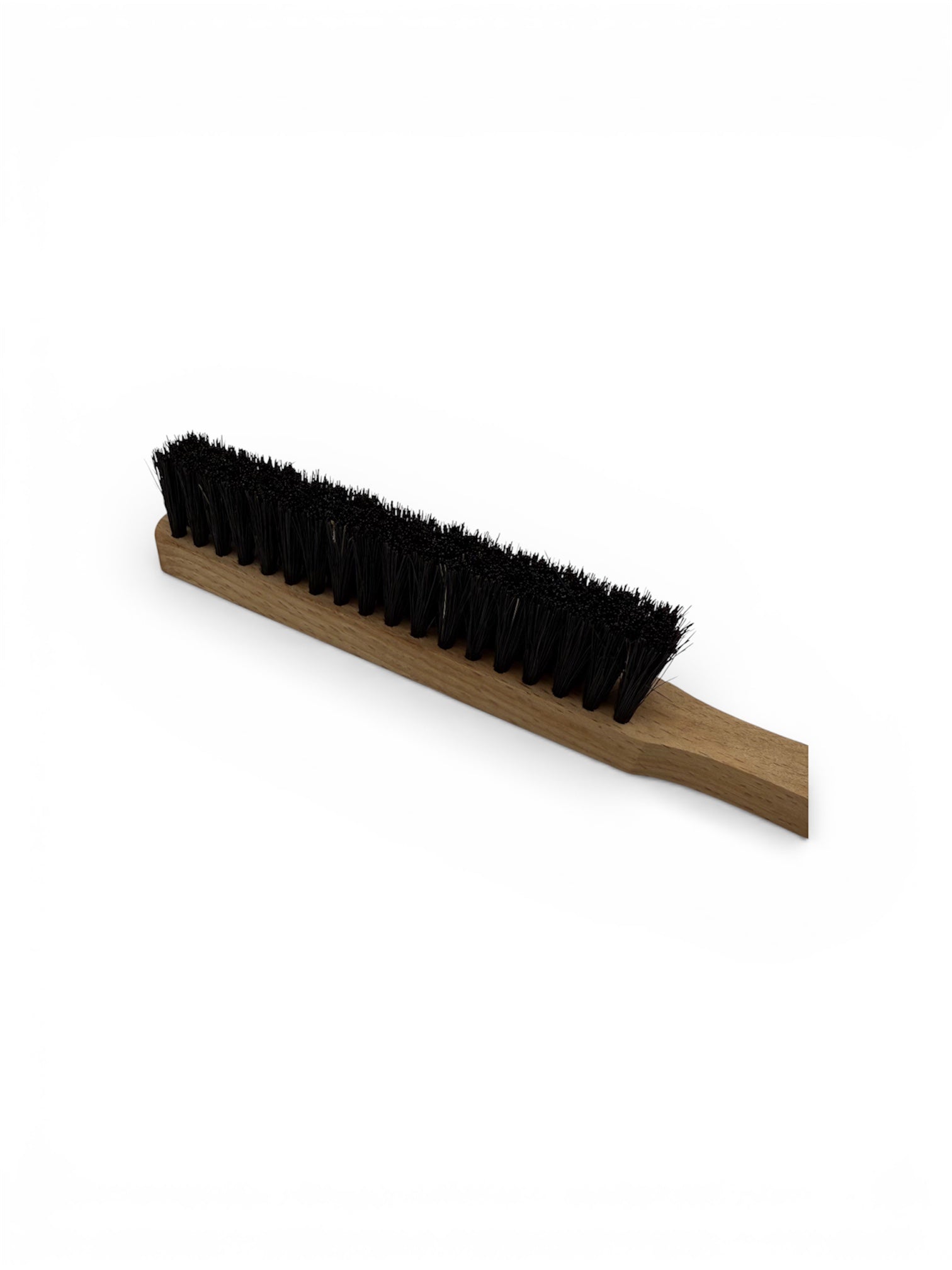 Close up of a black bristle brush for jewellery benches