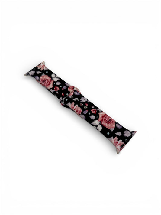 A long, narrow rectangular item with a black background and a pink rose floral pattern, photographed on a plain white background.