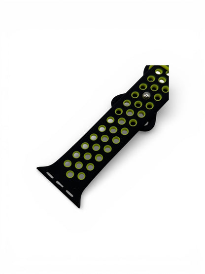 Close up of a black and yellow silicone watch strap