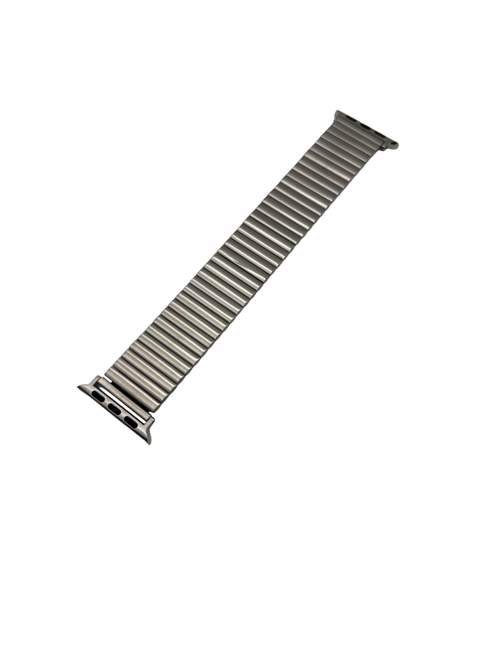Metallic watch strap on a white background