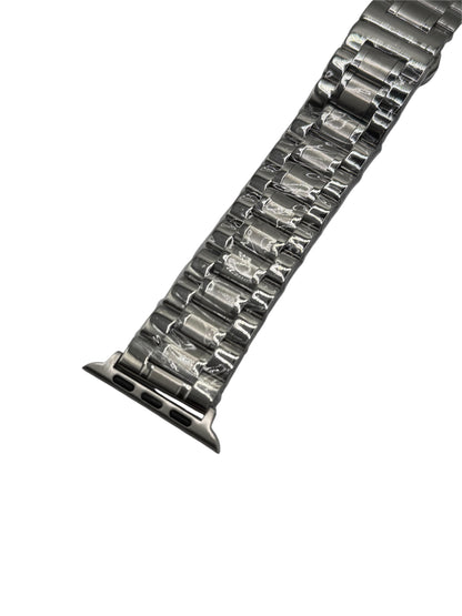 Metallic watch strap on a white background