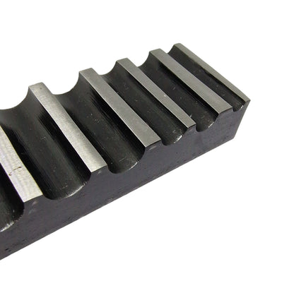 A close up of a  single-sided steel bending block with ten half-round grooves, used for forming, bending, and shaping metals.