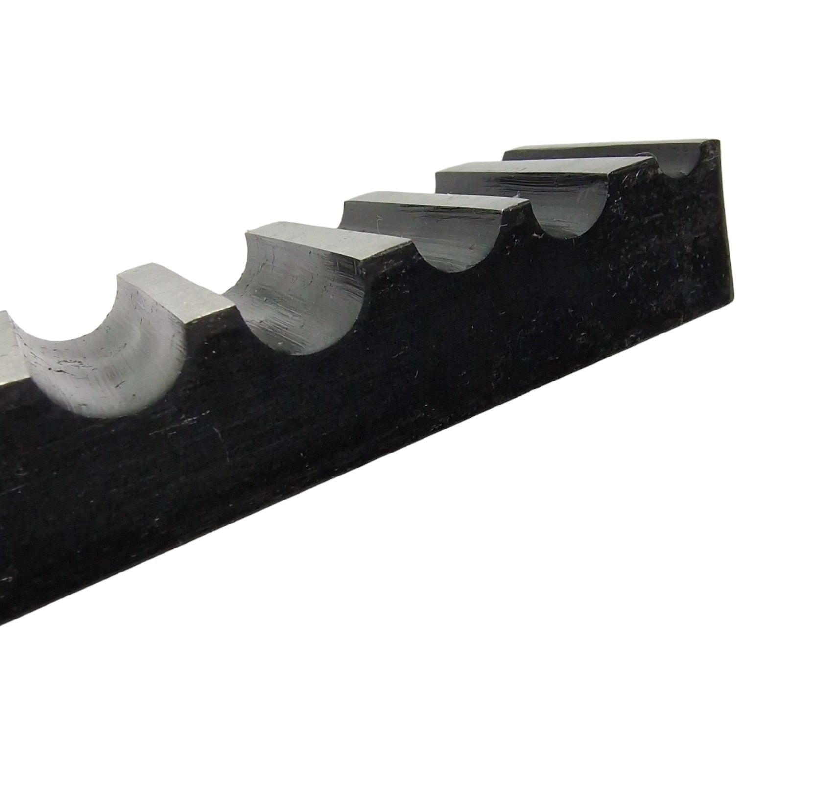 Side view of a single-sided steel bending block with ten half-round grooves, used for forming, bending, and shaping metals.