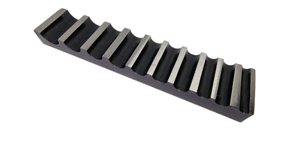 A single-sided steel bending block with ten half-round grooves, used for forming, bending, and shaping metals.