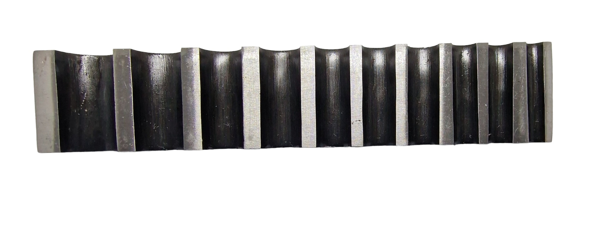 Top view of a single-sided steel bending block with ten half-round grooves, used for forming, bending, and shaping metals.