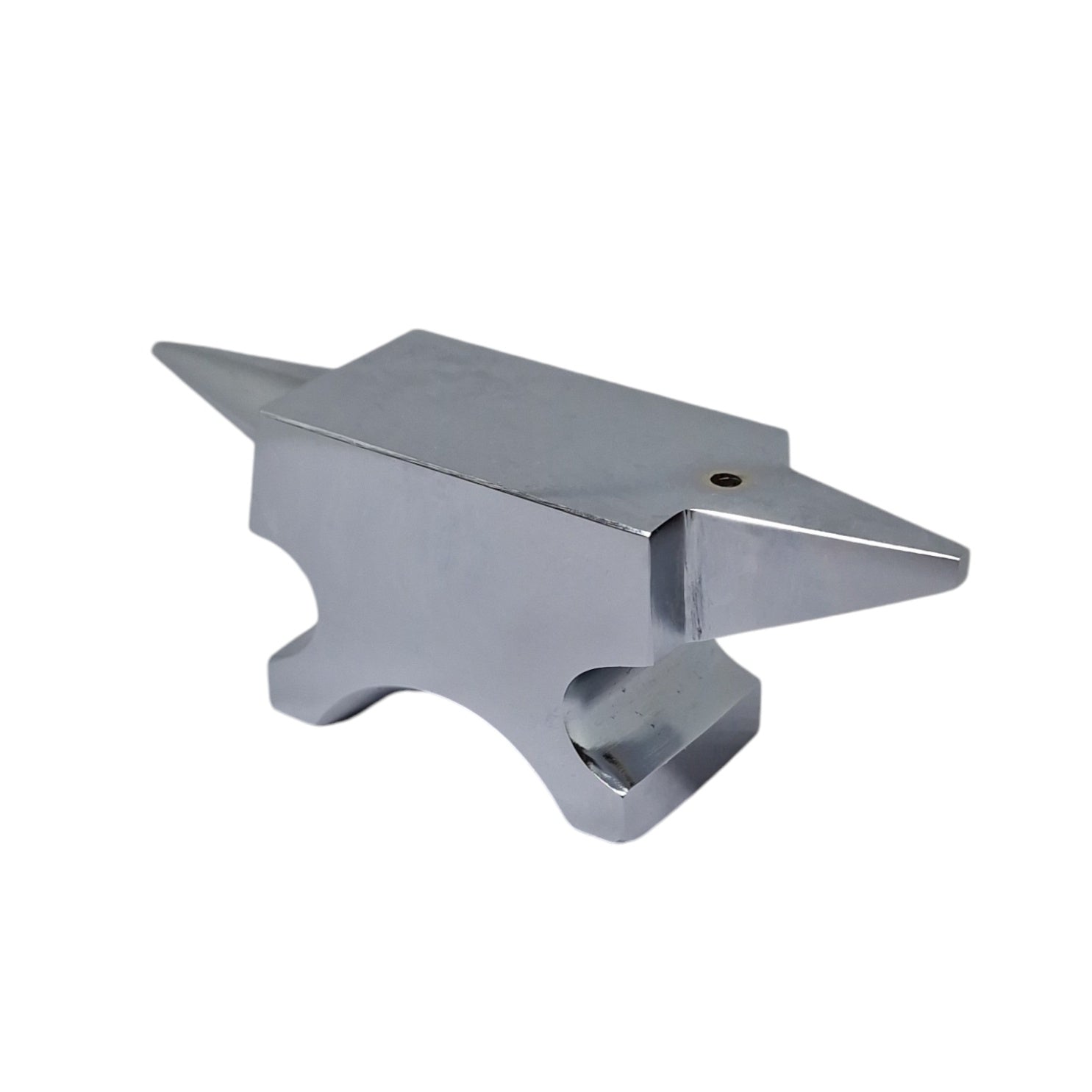 A polished silver anvil with one round horn and one flat base with a hole in the top face for riveting work.