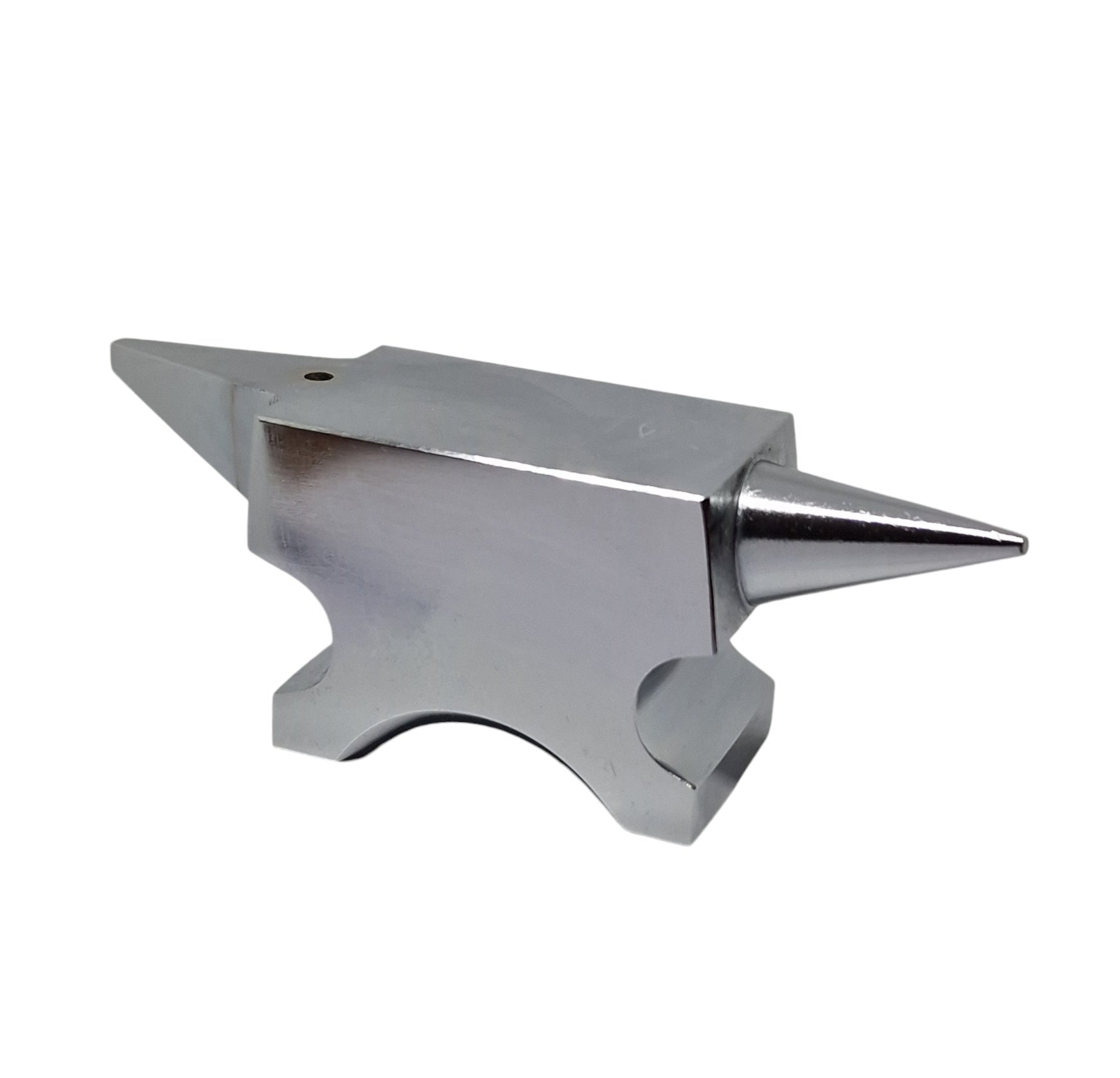 A polished silver anvil with one round horn and one flat base with a hole in the top face for riveting work.