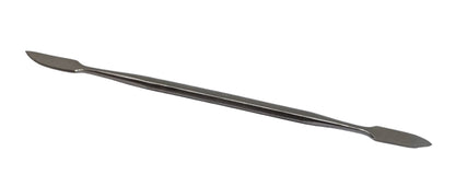 Double ended wax tool on a white background