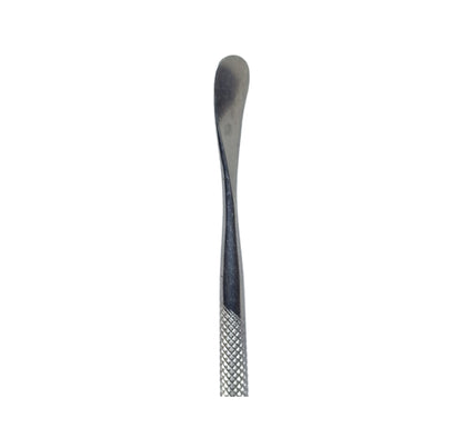 A double-ended stainless steel wax carving tool with a pointed tip on one end and a serrated surface on the other.