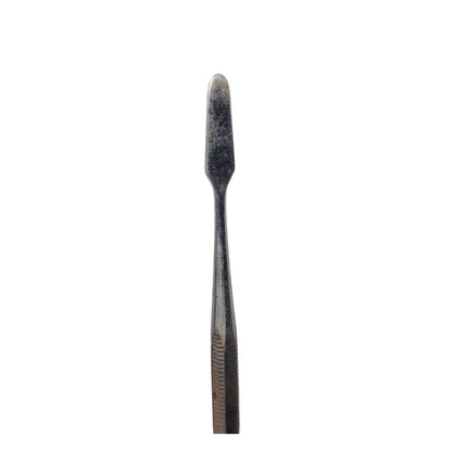 A stainless steel wax carving tool with a tapered end used for jewelry making.