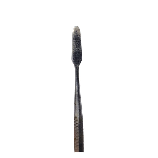 A stainless steel wax carving tool with a tapered end used for jewelry making.