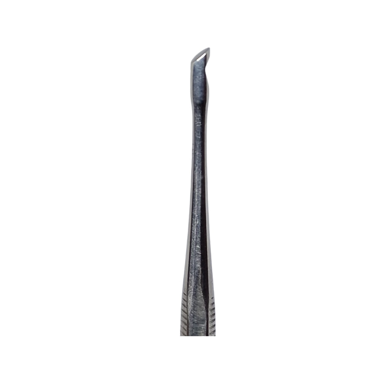 A double-ended stainless steel wax carving tool with one pointed end and one flat end, with visible grooves and usage marks.