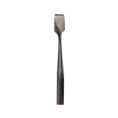 A double-ended stainless steel wax carving tool with a textured surface.