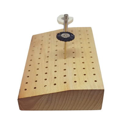 Side view of a wooden storage block containing tools